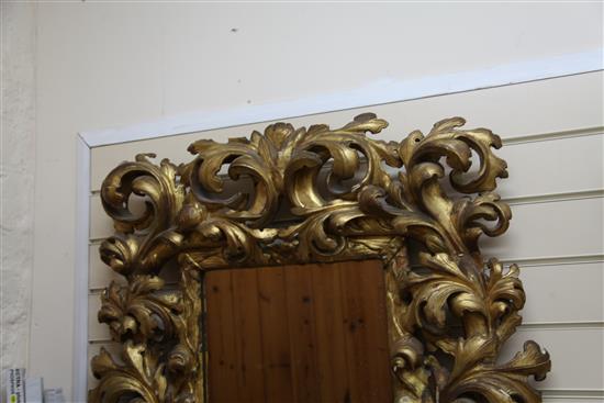 An 18th century Italian carved giltwood wall mirror, 3ft x 2ft 8in.